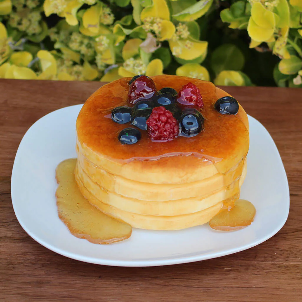 Small Plate Of Pancakes Topped with Fruit